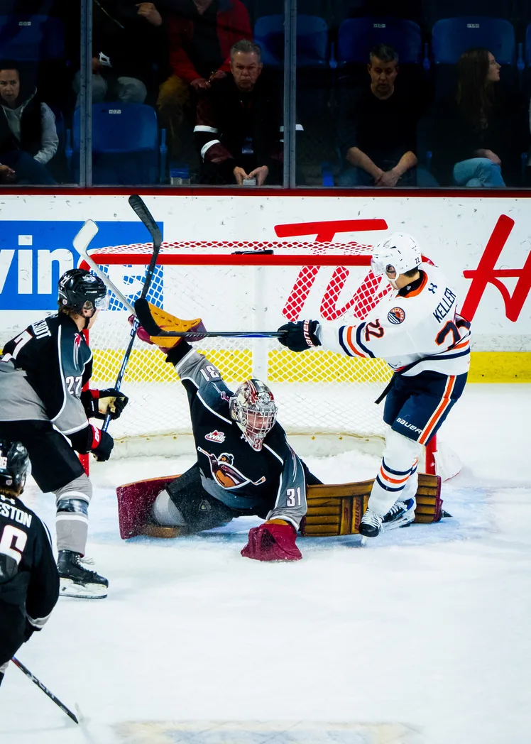 Vancouver Giants goaltender making a save against the Kamloops Blazers at Langley Events Centre